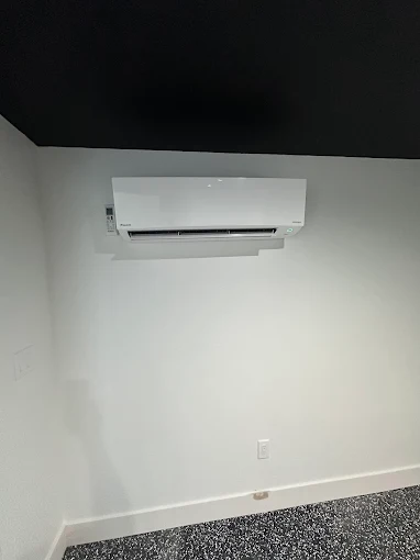 Indoor heat pump unit professionally installed on wall in Turlock home with clean white finish